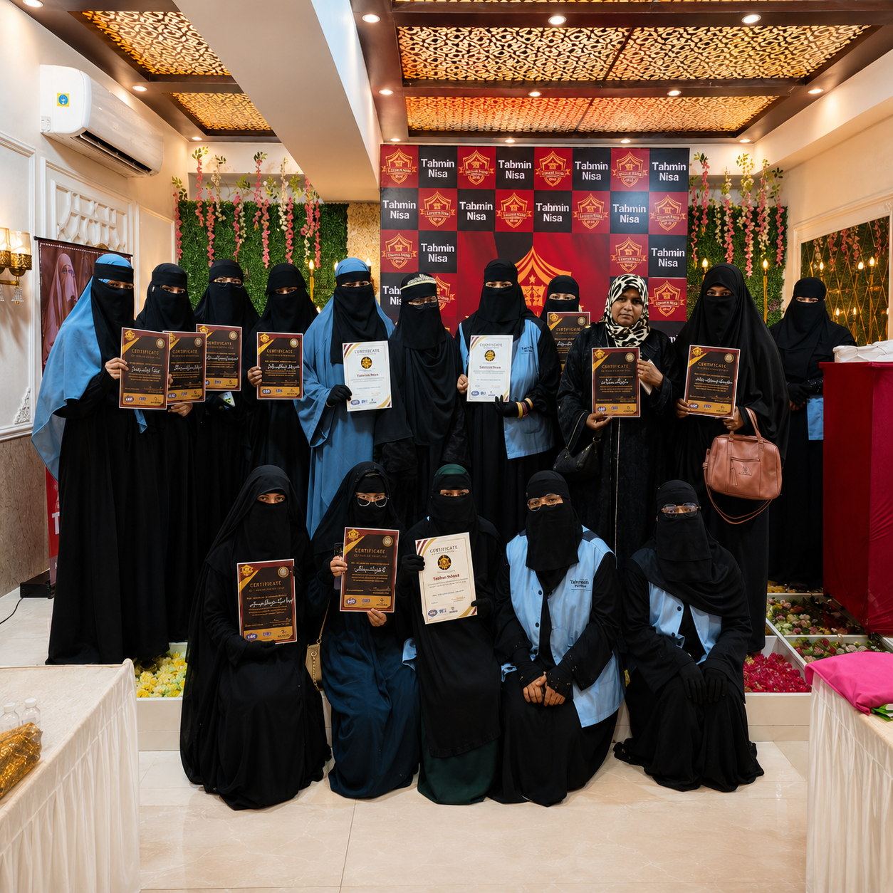 Graduation students proudly holding certificate shields at Shaheen Academy event